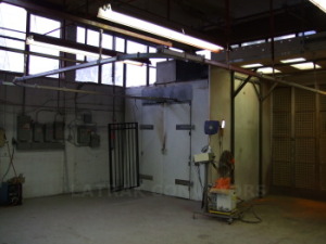 Overhead conveyor from paint booth to batch oven